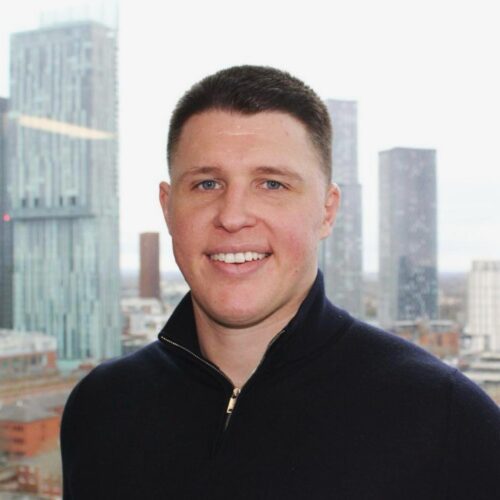 Man in city wearing black jumper